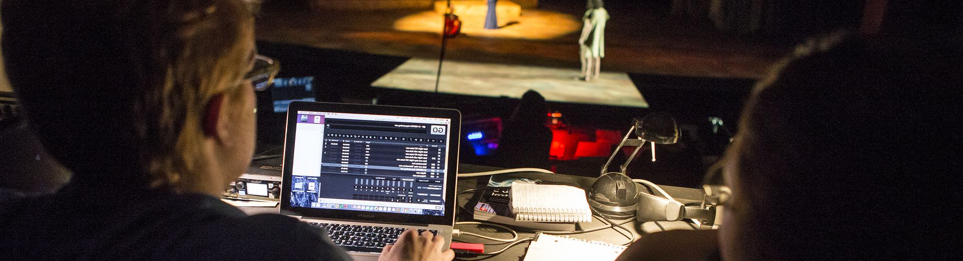 Director overseeing a theater rehearsal.