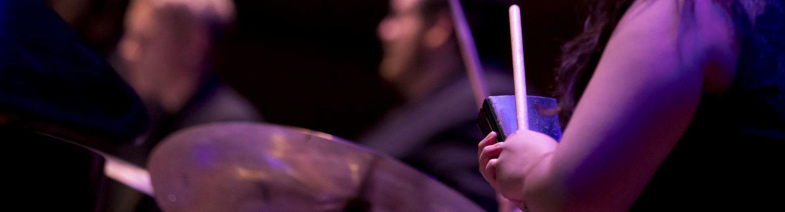 Women playing percussion.