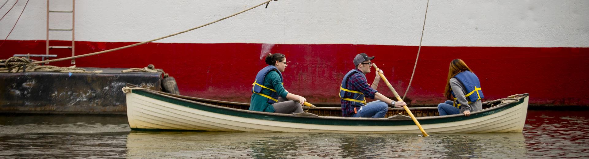 Temple graduate students in the Material Cultures class in a boat at the seaport museum