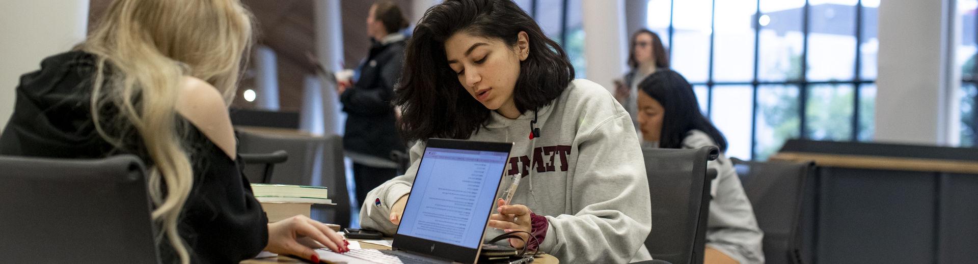 students studying in Charles Library. 