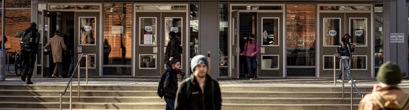 Temple students leaving the Tuttleman Learning Center on Main Campus.