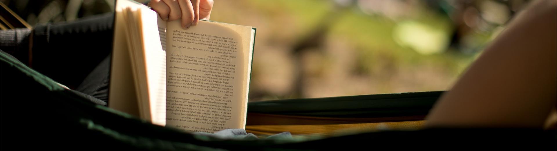 student reading in a hammock 