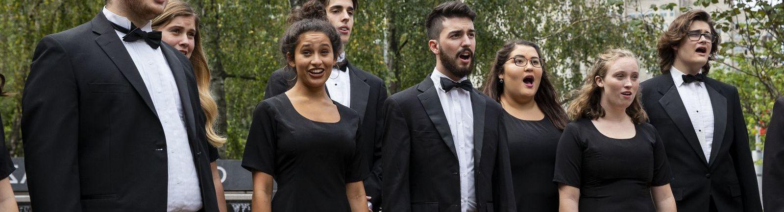 Temple's Boyer College of Music and Dance Concert Choir singing in a performance outdoors.